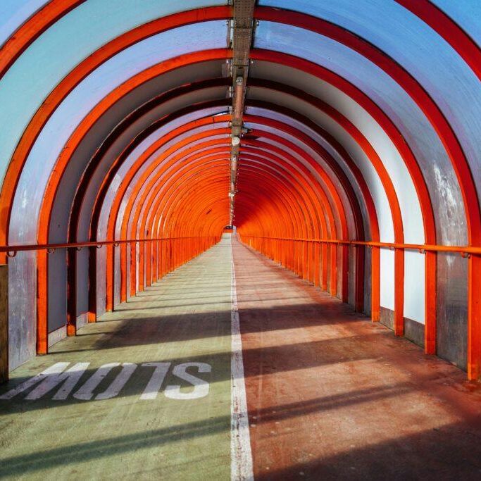A sunlit tunnel symbolizing the intersection of reflection and action — the heart of creative coaching and direction. A sunlit tunnel symbolizing the intersection of reflection and action — the heart of creative coaching and direction.